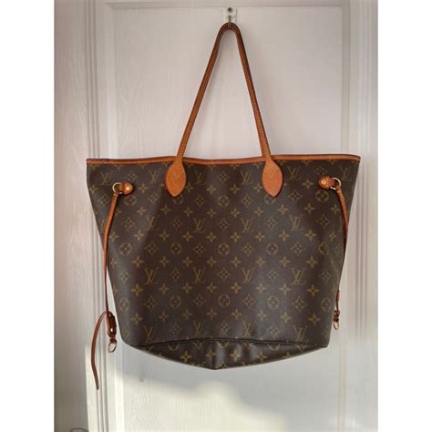 louis vuitton neverfull mm ราคา มือสอง|ร้านรับซื้อ.